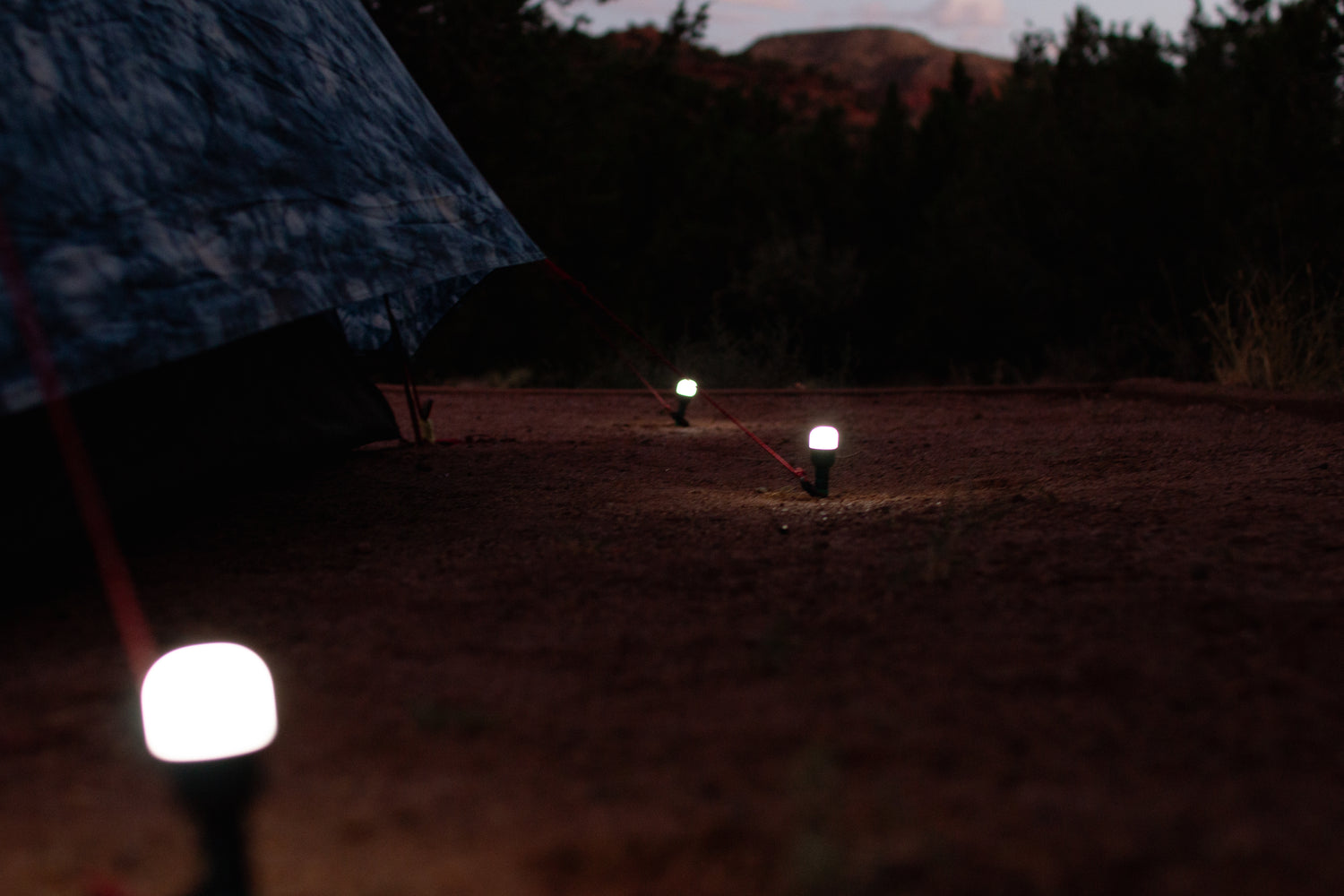 BioLite Site Lights illuminating a campsite with glowing bulbs