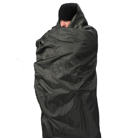 Snugpak Jungle Blanket wrapped around a man
