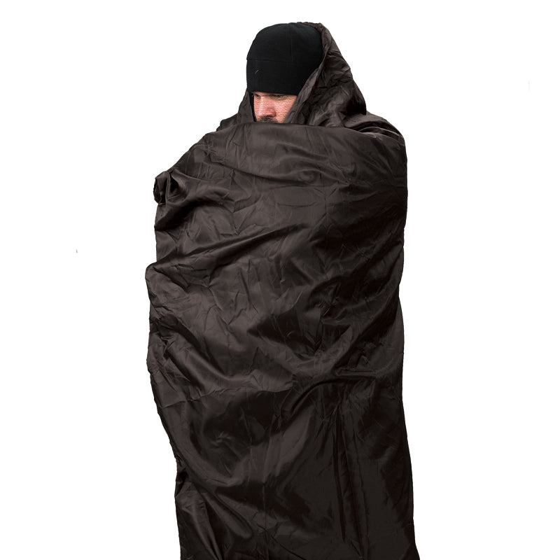 Snugpak Jungle Blanket wrapped around man