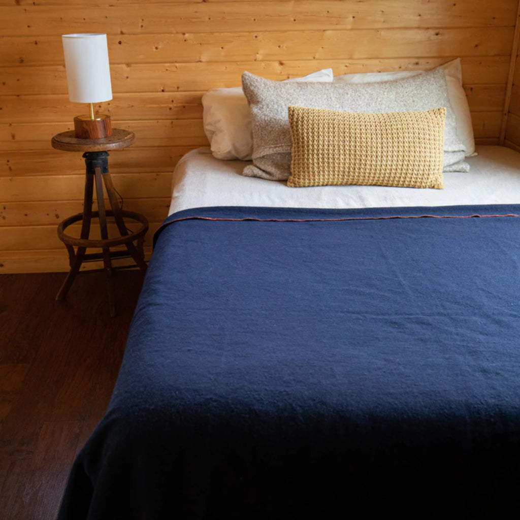 Heavy-duty Arcturus wool blanket laid over a bed