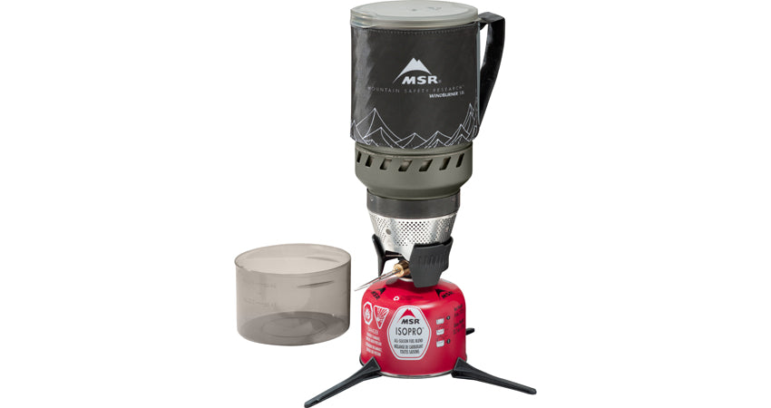 MSR WindBurner stove system with lock on pot, ISOPRO propane tank, and a measuring cup. the pot is a black colour with outlines of a mountain in white.
