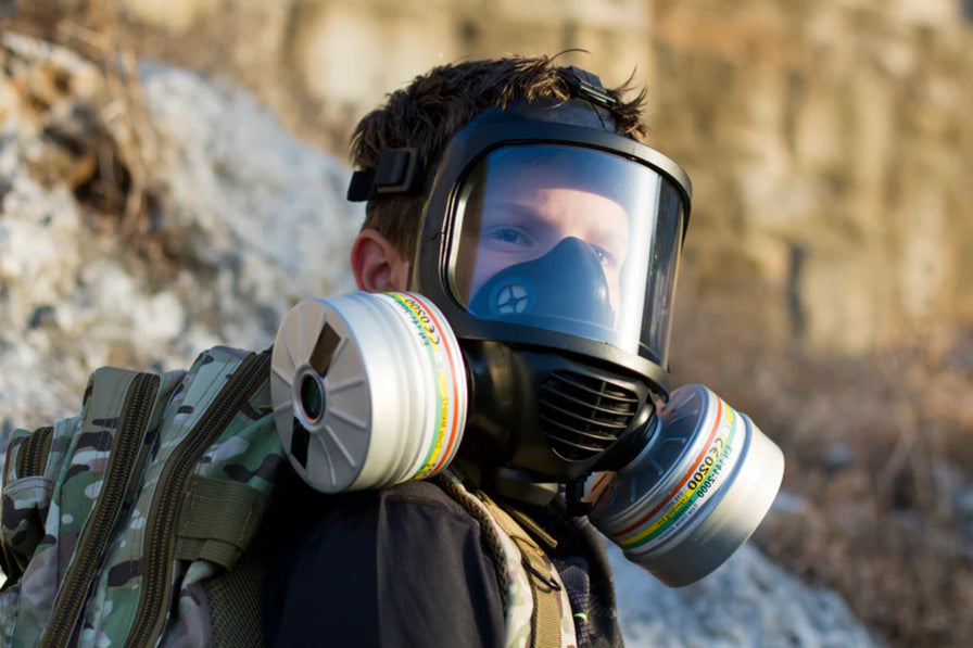 Man wearing MIRA Safety Gas Mask with filters