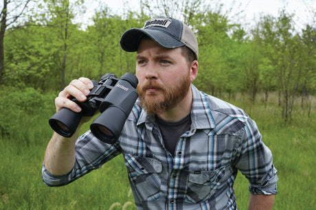 Man watching waith Bushnell Powerview 10 x 50 Binoculars