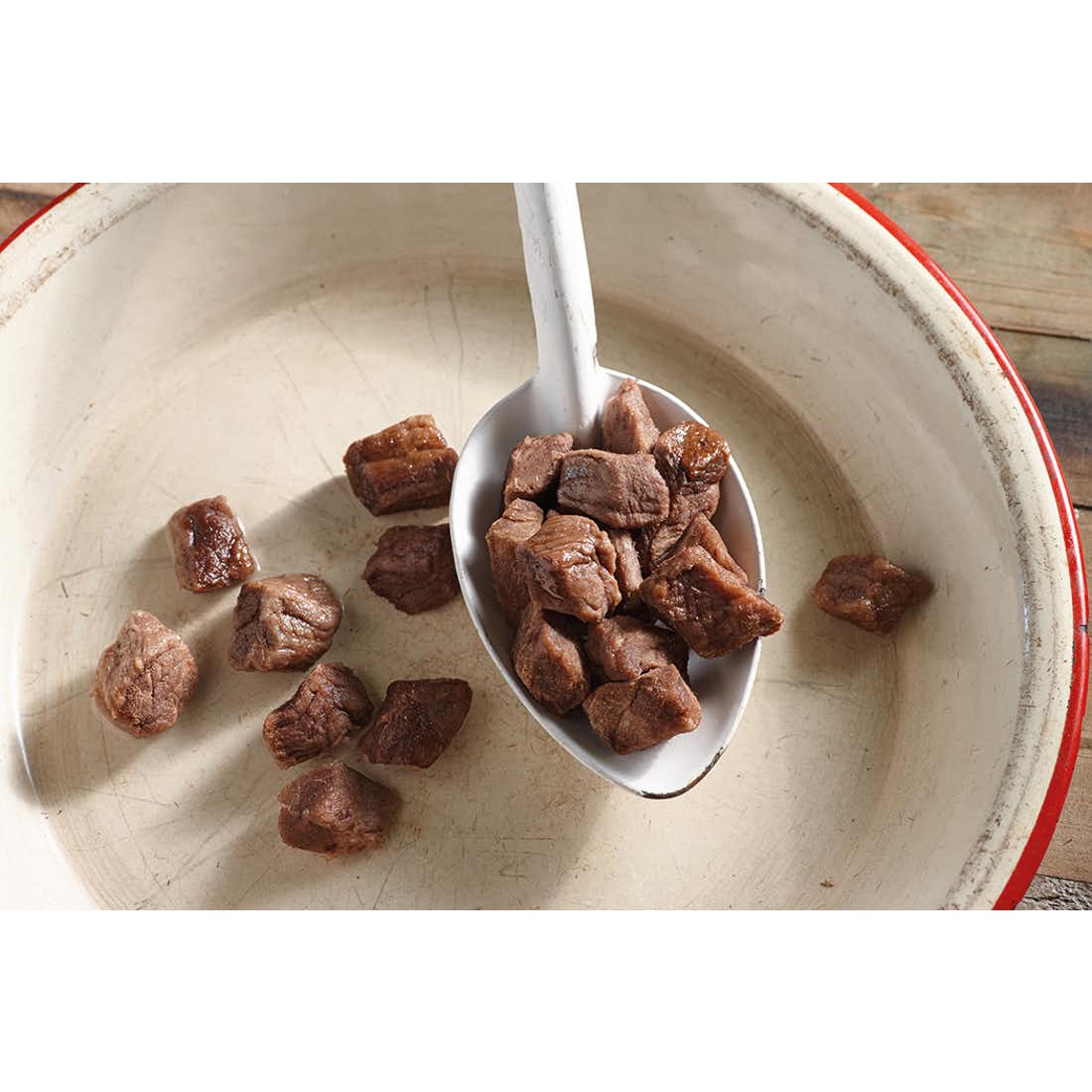 A camping bowl of Happy Yak's Freeze Dried Beef Cubes.