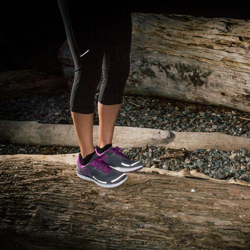 Reflective tape put on purple running shoes.