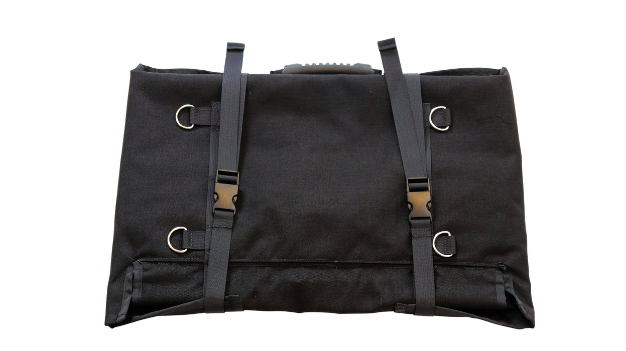 The back of the bugout roll with rope loops and two hard plastic belt clips holding the bag tightly closed.