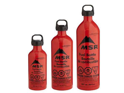 MSR Fuel Bottle canisters in a deep orange colour. The bottles have the dangerous flammable, combustable, and explosive whims labels.