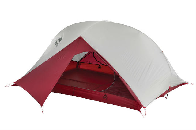 MSR Carbon Reflex Ultralight 3 Person tent. The Weather proof cover is placed on the tent body and the entry way is open in a deep red color. Other than the front entry, the tent is a grey color.