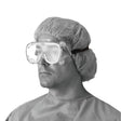 Fluid Protective Goggles on a man wearing a hair net and hospital gown.