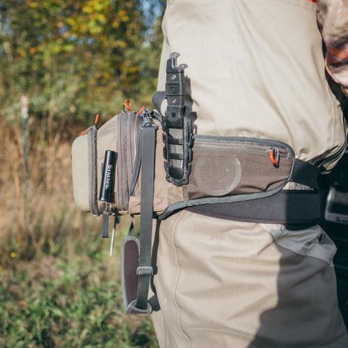Gear Aid Buri knife mounted to a fanny pack outdoors.