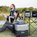 Couple outdoors at a lake using the Zendure SUPERBASE 600 Watt Solar Generator charging examples