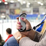 demonstration of Zippo HeatBank 9S Plus heating a woman's hand at a hockey rink