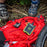 The venture 30 power bank on mountain bikers red backpack charging up a gopro camera.