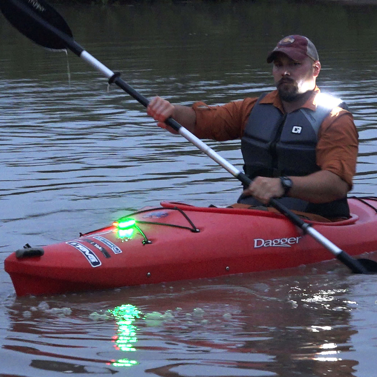 Guardian Angel Magnetic mount on a Red Dagger kayak and kayakers life jacket vest.