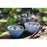 2 Pale Blue bowls of Happy Yak Chia with Almonds and Cranberry preppared Freeze Dried Food. The bowls are on a picnic table beside a kettle of hot water that was used to prepare the food.