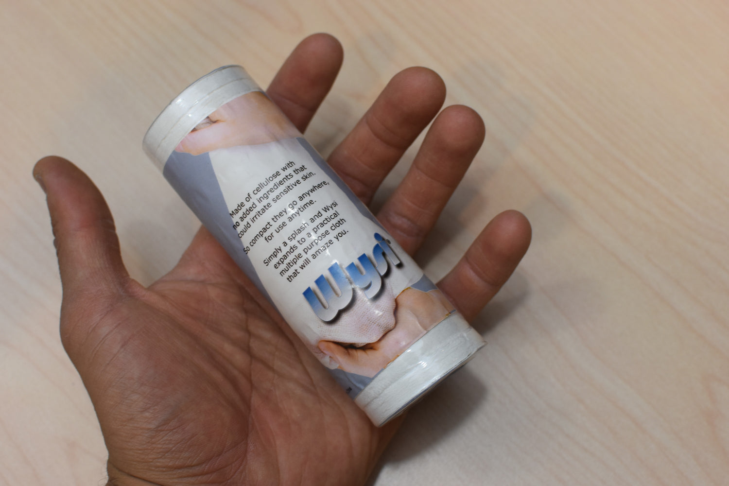 roll of wysi toilet paper discs in mans hand