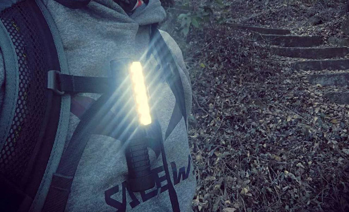 Acebeam PT40 Waterproof & Impact-Resistant Pocket Flashlight in use attached to back pack