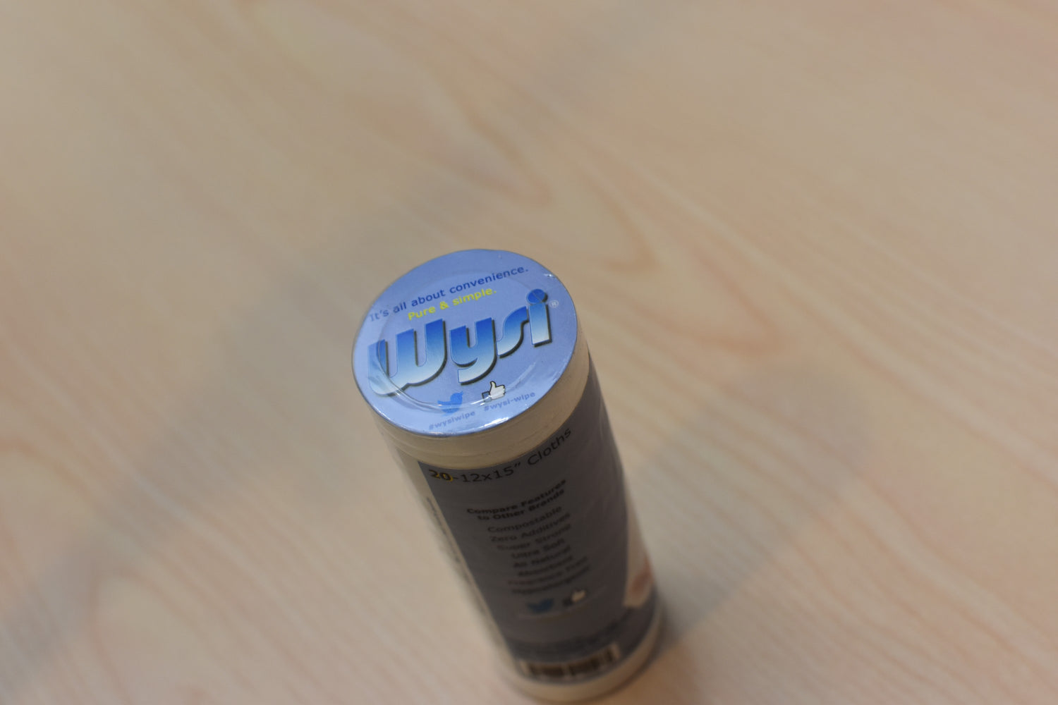 top of wysi toilet paper discs in mans hand