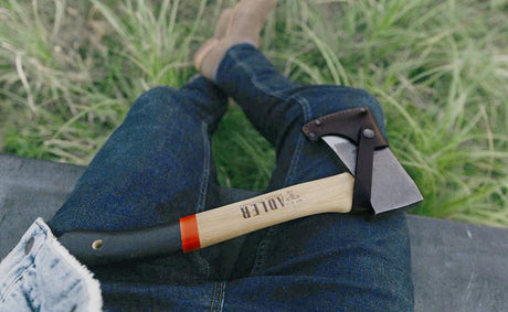 Adler Yankee Hatchet with sheath on a man's lap